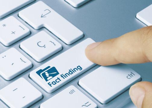 Fraud investigator examining financial documents for evidence of fraud
