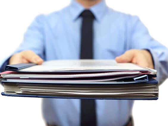 Process server handing legal documents to a respondent at their residence
